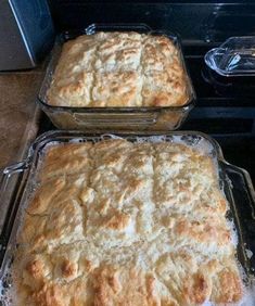 two pans filled with food sitting on top of a stove