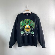 Vintage 1995 Green Bay Packers NFL Football Crewneck Sweatshirt Team Sportswear  Condition : Used vintage Good conditions Details :stains (Look at the picture) Please Let me know if you have any      questions or More Photo Detail Brand : Jerzees  Made in : USA  Measurement Size On Tag : L, (fit like M) Pit to pit : 22 inches Length : 28 inches Material : Cotton Polyester Color : Black  *Please keep in mind that our items are vintage so they may show some signs of wear and tear *Please read everything before buying  No Cancel  No Refund  No Return  payment Accept PayPal only. Please give us your phone number together with address after you purchasing.( No P.O Box  shipping to worldwide Item will shipped in 1-3 days after payment. ( remote area The shipping cost is higher) Thank you :) 49ers Game, Football Crewneck, Nfl Packers, Crimson Tide, Green Bay Packers, Nfl Football, Green Bay, Crewneck Sweatshirt, Nfl