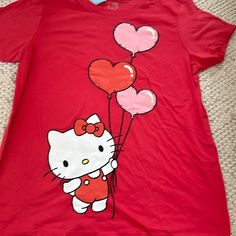 Hello Kitty Nwt Short Sleeve Shirt Size Large. The Color Is A Mix Of Red And Pink. This Short Sleeve Shirt Is So Cute!!! Thanks For Looking. Ships From Atlanta Smoke And Pet Free Home Hello Kitty Red Cartoon Print Top For Spring, Fun Hello Kitty Short Sleeve Tops, Playful Hello Kitty Short Sleeve Tops, Red Cartoon Print T-shirt For Spring, Cute Red Crew Neck Top, Cute Red Fitted T-shirt, Fun Red Spring Shirt, Cute Fitted Red T-shirt, Red Cotton Hello Kitty T-shirt