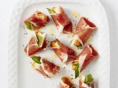 slices of prosciutto on a white plate