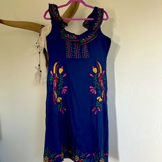 Nwt Size M Blue Cross Stitch Embroidered Midi Dress. Side Zipper And Fully Lined. So Cute, Sadly Never Worn (Because I Got Pregnant And Didn’t Fit Into It ). Blue Bohemian Dress With Embroidered Neckline, Traditional Blue Embroidered Dress With Embroidered Hem, Traditional Blue Dress With Embroidered Hem, Blue Fitted Folk Dress, Blue Bohemian Dress With Embroidered Hem, Blue Dresses With Embroidered Hem, Blue Sleeveless Embroidered Beach Dress, Blue Sleeveless Dress With Floral Embroidery, Blue Folk Style Embroidered Beach Dress