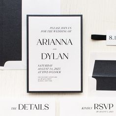 the wedding stationery is laid out on top of each other, including black and white envelopes