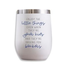 a white wine glass with blue writing on the side and an inscription that reads, enjoy the little things even when they're go