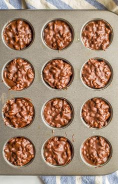 chocolate cupcakes in a muffin tin ready to be baked