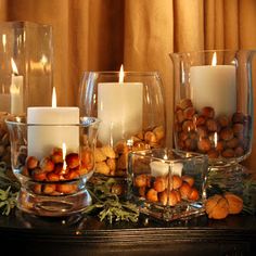 candles and nuts are arranged on a table