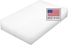 the made in usa mattress pad is white and has an american flag patch on it