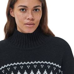 Casual comfort meets warmth and style with the Barbour Pine Knit Top. with a cotton, polyester, wool, and nylon blended fabric, this sweater is soft, warm, and comfortable. A ribbed collar, hem, and cuffs add to the style and fit of the sweater, and the loose and flowy cut is super comfortable to lounge around in. Classic Winter Sweater With Fair Isle Pattern, Classic Fair Isle Sweater For Winter, Cozy Turtleneck Polo Sweater With Ribbed Cuffs, Classic Fair Isle Winter Sweater, Nordic Style Warm Sweater For Cold Weather, Classic Winter Sweater With Ribbed Collar, Nordic Sweater For Winter, Nordic Winter Sweater For Cold Weather, Cold Weather Wool Sweater With Ribbed Cuffs