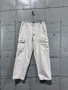 90s baggy Cherokee  cargos pants.  Good condition  Tagged 32x30  But please review measurements as vintage items fit smaller than moder.  30"Waist 28"Inseam 13"Rise 8"Leg opening Thank you! Check out our other listings. Casual Beige Cargo Jeans With Belt Loops, 90s Style Baggy Cargo Pants With Pockets, 90s Style Cargo Pants With Side Pockets, Vintage Baggy Cargo Pants With Cargo Pockets, Vintage Full Length Cargo Pants For Streetwear, 90s Style Full Length Cargo Pants With Side Pockets, Beige Straight Leg Cargo Jeans For Streetwear, Full Length Beige Cargo Pants With Cargo Pockets, 90s Style Cotton Cargo Jeans With Pockets