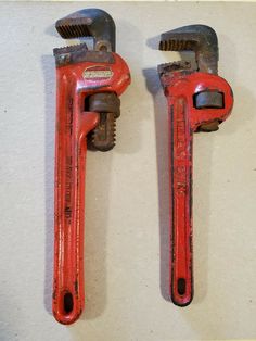 two red wrenches sitting next to each other