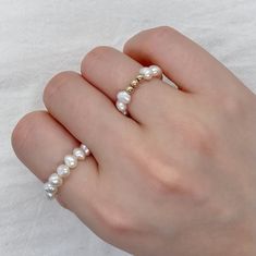 Featuring beautiful baroque pearl and three dainty gold filled beads, this Baroque Pearl Ring is the perfect accessory for any occasion. Each ring is made to order, ensuring that you receive a one-of-a-kind piece that is perfect for you. D E T A I L S *  14K Gold Filled. *  Pearl is genuine freshwater baroque pearl. *  Pearl measures 4-5 mm. *  Tarnish-free and safe for sensitive skin. C R A F T I N G  *  S H I P P I N G *  We handcraft each piece to order, so please allow 3-5 business days for processing before shipment. *  Orders typically ship via USPS First Class Mail and arrive within 2-5 business days within the US.  R E T U R N  *  E X C H A N G E *  We want you to be completely satisfied with your purchase. If for any reason you are not happy with your order, please contact us with Gold Baroque Pearl Ring For Wedding, Gold Baroque Pearl Ring As Gift, White Pearl Ring With Round Beads For Wedding, Gold Baroque Pearl Ring Gift, Gold Pearl Beaded Rings, Freshwater Pearl Ring, Beaded Ring, Jewelry Bridesmaid, Etsy Bridesmaid Gifts