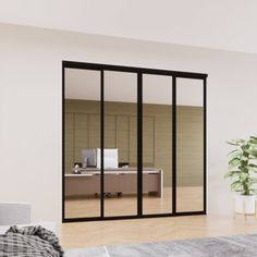 an empty room with sliding glass doors and a plant in the corner next to it