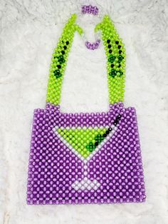 This beaded handbag is a true original! At approx. 9"X 8"X 2" It's the perfect size for your phone, keys and cards.  The 20" strap is great for over the shoulder and nestles high and securely.  Also a wonderful length to carry by handle down by the hip.  Made of acrylic beads, so its super easy to handwash when needed.  Made by Lora Rolling.  Ships to US (only) via USPS.  Arrives within 7 days! All sales are final. Questions? Text 214-872-0062 Green Beaded Shoulder Bag For Everyday Use, Summer Party Purple Shoulder Bag, Beaded Purple Bag For Everyday Use, Purple Beaded Bags For Everyday Use, Purple Beaded Bag For Everyday Use, Purple Beaded Shoulder Bag For Everyday Use, Rectangular Phone Bag For Party With Cell Phone Pocket, Rectangular Phone Bag With Cell Phone Pocket For Party, Rectangular Party Phone Bag With Cell Phone Pocket