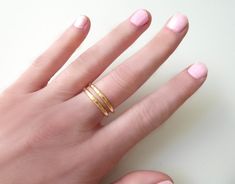 "Gold Stacking Ring Bands ~ 100% 14k Gold Filled *Listing is for one ring *Ring is hammered, rustic, and handmade. Each ring is a little different. You may see a small inconspicuous area where the ring is soldered on inside of band. This adds texture, a little character and imperfections that make each ring rusticly unique. This dainty and shiny ring is great alone or for stacking together. This can be worn on most any finger including your ring finger, middle finger and thumb. ~ These shiny rin Yellow Gold Double Band Gift, Yellow Gold Double Band As Gift, Yellow Gold Stackable Double Band Rings For Gifts, Yellow Gold Double Band Stackable Rings For Gifts, Yellow Gold Double Band Stackable Rings As Gift, Gift Yellow Gold Double Band Stackable Rings, Yellow Gold Double Band Midi Rings Gift, Promise Ring For Girlfriend, Shiny Ring