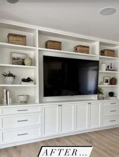 a white entertainment center with built - in cabinets and a flat screen tv on the wall