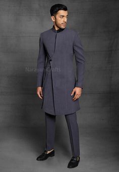 Product Description - The first and most important rule of men's style is you should feel comfortable and confident in your clothes. You will need both these attributes to pull off just about any outfit successfully. A suit that fits increases your confidence and makes you look good. Regardless of how 'classy' or expensive they might be. New Stylish handmade Decent Sherwani for men for wedding and festive occasions.  Stylish New Ethnic Sherwani for men Top Details  -  Color  -  Dark Grey Fabric Fitted Sherwani With Stand Collar For Diwali, Fitted Stand Collar Traditional Wear For Diwali, Fitted Traditional Wear With Stand Collar For Diwali, Fitted Bandhgala With Stand Collar For Diwali, Traditional Drape Nehru Jacket For Winter, Semi-formal Fitted Kurta With Stand Collar, Fitted Sherwani With Stand Collar, Fitted Sherwani With Stand Collar For Semi-formal Occasions, Fitted Stand Collar Sherwani For Semi-formal Occasions