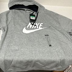 Nwt Mens Nike Logo Hoodie With Front Pocket Nike Gray Fleece Top, Nike Athletic Heather Tops For Winter, Nike Athletic Heather Winter Tops, Nike Casual Hoodie With Graphic Print, Casual Nike Hoodie With Graphic Print, Nike Gray Cotton Sweatshirt, Casual Fleece Tops With Logo Print, Nike Casual Sweatshirt In Athletic Heather, Nike Heather Grey Casual Hoodie