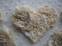 several pieces of lace and buttons on a table