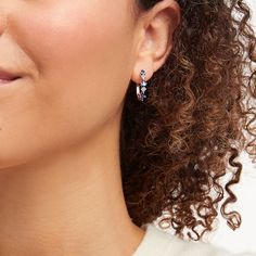 Trios of dazzling white lab-created sapphires sparkle between three rich oval-cut blue lab-created sapphires on each of these marvelous hoop earrings. Styled in sterling silver, the earrings secure with hinged backs. Blue Cubic Zirconia Hoop Jewelry, Sapphire Jewelry With Lab-created Sapphire, Sapphire Sterling Silver Hoop Earrings, Sapphire Hoop Earrings, White Lab, Earrings Sterling Silver, Sterling Earrings, Oval Cut, Sterling Silver Earrings