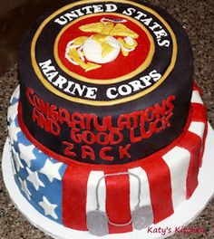 the cake is decorated with an american flag and marine corp seal on it's side