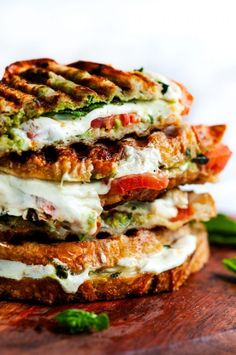 three grilled sandwiches stacked on top of each other