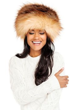 Simply showing up in a Russian-style hat THIS fabulous makes EVERYTHING more fascinating and fun! The excitement lies in Red Fox, one of the most beautiful and authentic furs weve encountered in nearly three decades of obsessing over faux fur. A visual feast of color, texture and toning, Red Fox is a glorious blend of Copper and Rust softened by Tawny Tans and Brown. Further enhanced with subtle Ivory and Tan tipping, this incredible fur has a silky, soft touch as well! The ultimate Winter acce Winter Hat With Feather Trim, Fluffy Faux Fur Hat For Fall, Winter Faux Fur Mink Hat, Fluffy Faux Fur Hat For Cold Weather, Winter Hats With Faux Fur Lining, Mink Colored Winter Hat With Faux Fur Lining, Faux Fur Hat For Fall, Mink Color Hat With Faux Fur Lining For Winter, Fall Hats With Faux Fur Lining