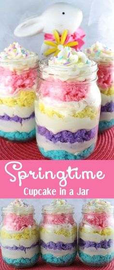 colorful cake in a jar with white frosting and sprinkles on top