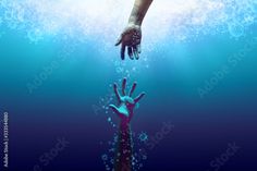 two hands reaching out from the water to touch each other's hand, as if they were underwater