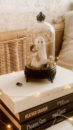 a snow globe sitting on top of two books