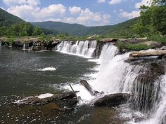 a large waterfall with lots of water coming out of it