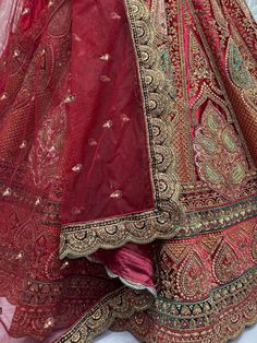 Indulge in the regal allure of this magnificent maroon color velvet bridal lehenga, meticulously crafted to adorn the bride in timeless elegance and sophistication. Luxuriously crafted from sumptuous velvet material, this ensemble is adorned with a mesmerizing array of embellishments, including multi-thread work, sequin work, diamond work, zari work, velvet embroidered patchwork, and fancy dori work, ensuring a breathtakingly opulent aesthetic.
Accompanying the lehenga is a matching velvet choli Bollywood Style Lehenga With Intricate Design, Bollywood Style Semi-stitched Lehenga With Intricate Design, Anarkali Dupatta With Intricate Design For Reception, Bollywood Style Reception Lehenga With Intricate Design, Intricate Design Floor-length Lehenga For Festive Occasions, Reception Choli With Intricate Design And Traditional Drape, Traditional Drape Choli With Intricate Design For Reception, Festive Floor-length Lehenga With Intricate Design, Floor-length Lehenga With Intricate Design For Festive Occasions