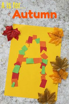 an autumn letter made out of paper and leaves