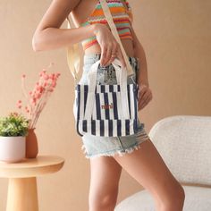 Elevate your accessory collection with our charming Mini Navy and White Striped Handbag! This stylish bag features a classic navy and white striped design, accented by the word "mini" printed in a vibrant orange, adding a fun pop of color to your look. Made from lightweight and durable canvas fabric, this mini tote bag is both eco-friendly and practical for everyday use. Its minimalist design includes inner and outer pockets for easy organization, while the secure zipper closure keeps your essen Cute On-the-go Satchel Bag, School Canvas Crossbody Bag With Top Carry Handle, Cute Rectangular Bags For Everyday Use, Cute Rectangular Canvas Bags, White School Bag With Top Carry Handle, On-the-go Canvas Mobile Phone Bag, Cute Everyday Box Shoulder Bag, Cute Satchel Box Bag For Everyday Use, Cute Rectangular Box Bag For Everyday Use