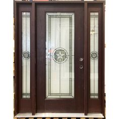 the front door is brown and has two glass panels