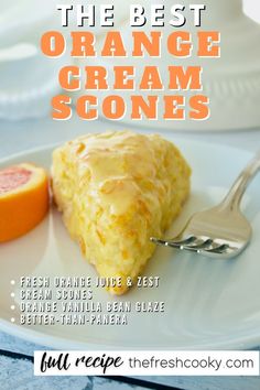 the best orange cream scones on a white plate with a fork and grapefruit