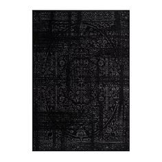 a black rug with white designs on it