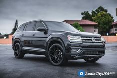 the volkswagen atlas is parked in a parking lot