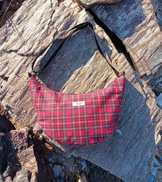 Our Tommy bags have a minimalist style. These red tartan plaid and blue white gingham versions have an outside zipper pocket. The bag is padded but still is very soft. It has adjustable straps that can go from a should bag lenght to crossbody. Measurements : 7x21x38cm. The red one has black plastic strap while the blue one has a strap made with the same fabric.  We make everything ourselves with fabric we source from producers or secondhand sellers. We try to repurpose over-production or secondh Plaid Bags With Adjustable Strap, Plaid Bags With Adjustable Strap For Everyday Use, Everyday Plaid Bag With Adjustable Strap, Plaid Shoulder Bag For Everyday Use, Everyday Gingham Bag With Adjustable Strap, Tommy Bags, Gingham Bag, Plaid Bag, Red Crossbody Bag