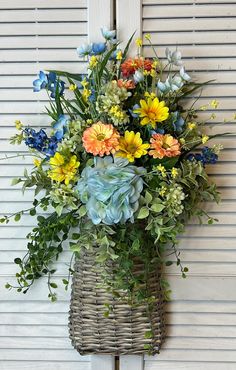 a basket filled with lots of colorful flowers