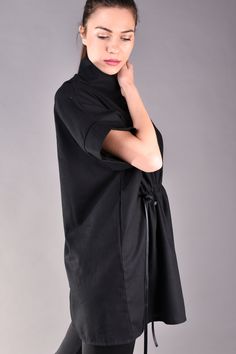 "Linen Shirts, Linen Blouse, Loose Linen Shirt, Linen Clothes. Linen blouse is the perfect choice for the summer as it keeps you cool even though it is black. This oversized shirt is loose fit but can be tightened at the waist thus the body will look more feminine and the waist area will be emphasized. The model features trendy kimono sleeves and a wide collar. It looks very stylish matched with black legging for all black look but added a colour popping handbag or shoes. ^ Sizes: The item can b Relaxed Fit Tunic Tops For Daywear, Casual Black Tunic Top, Cotton Tunic Tops For Work, Black Cotton Tunic Top, Black Tops With Shirttail Hem For Daywear, Oversized Cotton Short Sleeve Blouse, Oversized Short Sleeve Cotton Blouse, Oversized Cotton Blouse With Batwing Sleeves, Oversized Cotton Batwing Sleeve Blouse