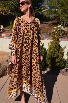 Striking silk  caftan with brown leopard  print on a gold background is truly spectacular for any occasion.   One size.  Fits many sizes from small ti X large .  The width is 52 inches from edge to edge and the length is 51 inches. Gold Kaftan For Summer Vacation, Gold Bohemian Kaftan For The Beach, Silk Dress Beach, Long Silk Dress, Silk Caftan, Coverup Beach, Silk Kaftan, Silk Dress Long, Gold Background