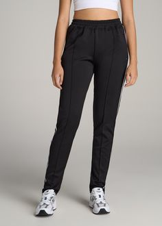 About Our Women's Tall Workout Pants Feel confident walking onto the court, running along the track or hanging out at home in our women's tall athletic pants. It can be difficult to find activewear that fits your tall frame, which can put a damper on your workout or training session. That's where we come in. We design clothes specifically for tall women up to 6'6” so you can rock your activewear with confidence. These athletic pants are engineered for performance and are made of a medium-weight Tall Workout, Stripe Pants, Design Clothes, Elastic Waist Pants, Pants Design, Tall Women, Athletic Pants, Waist Pants, Womens Sweatpants