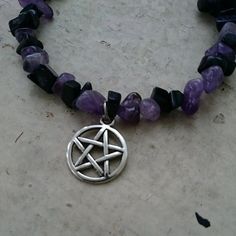 Enchanted Amethyst Pentacle Bracelet made with silver toned metal charms, amethyst and blue goldstone. Adjustable. Note: each jewelry piece is a little different due to the nature of natural crystals. *NOTE: this item is made to order and may take 1-2 weeks to ship. Spiritual Purple Jewelry With Charms, Purple Amethyst Symbolic Jewelry, Symbolic Amethyst Purple Jewelry, Symbolic Purple Amethyst Jewelry, Metal Charms, Blue Goldstone, Precious Gems, Gems And Minerals, Metal Charm