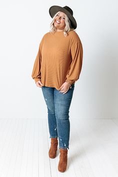 If you're a fall kinda girl, then this cute pumpkin hued plus size shift top is perfect for you! It features soft material, a rounded neckline, long bubble sleeves with fitted cuffs, and a slouched silhouette that falls into a straight hemline!                                   Measurements 1XL variant has  a Bust of 46",  a Hip of 46",  a Length of 25",  a Sleeve Length of 19.5",  a Waist of 44".  2XL variant has  a Bust of 48",  a Hip of 48",  a Length of 26",  a Sleeve Length of 20",  a Waist Cute Pumpkin, Rounded Neckline, Model Fits, Women Clothing Boutique, Online Womens Clothing, Distressed Jeans, Soft Material, Boutique Clothing, Length Sleeve