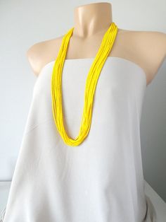 Long Yellow beaded necklace,yellow boho necklace,bridesmaids necklaces,seed bead jewelry,bridesmaids gift,multi strand necklace,summerIt has 12 strands and is available in several lengths. Please read specifications on SIZES below:❤ SIZESThis item comes in several sizes, kindly choose at checkout. The easiest way to find out which length suits you best is to measure a necklace you already own, from one end to the next, including clasp. You can also use the diagram on the pictures as a reference, Yellow Beaded Chain Necklaces For Summer, Summer Yellow Beaded Necklaces, Elegant Yellow Beaded Necklaces With Tiny Beads, Yellow Multi-strand Beaded Necklaces For The Beach, Yellow Beaded Necklaces With Gold Beads For Beach, Yellow Gold Beaded Necklaces For Beach, Bohemian Yellow Necklaces For Wedding, Yellow Beaded Multi-strand Necklaces, Yellow Multi-strand Beaded Chain Necklace