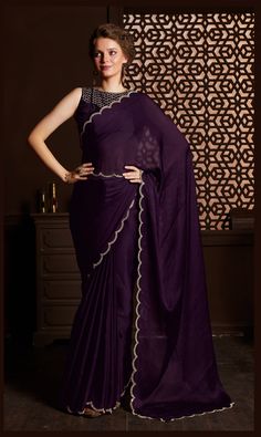 About Saree : Elevate your style with our exquisite purple saree, adorned with intricate hot fix zarkan stone work. The mesmerizing design extends to the neck, sleeves, and blouse, which comes with a complementary belt. Be the center of attention at any party or wedding, radiating elegance and charm. • Has blouse piece: Yes • Blouse Fabric: Satin Crepe Saree• Work: Banarasi Designs (Machine Woven with Zari)• Fall / Pico: Comes with Fall and edging (Pico)Shipping weight: 2 lb. Blouse Making Optio Purple Satin Saree, Lehenga Crop Top, Saree Work, Purple Saree, Cocktail Wear, Velvet Blouse, Crepe Saree, Embroidered Saree