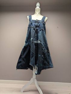 "Flowy upcycled denim patchwork dress with frayed seams and jagged hem. Bleached panels add to it's uniqueness. Wide shoulder straps for added comfort. Bust measures 34\" and length is approximately 41\"." Jagged Skirt, Denim Patchwork Dress, Patchwork Sweater, Patchwork Skirt, Knit Infinity Scarf, Upcycled Denim, Denim Patchwork, Poncho Sweater, Patchwork Dress