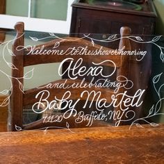 a wooden chair that has some writing on it