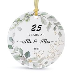 an ornament with the number twenty and two leaves on it, which reads 25 years as mr and mrs