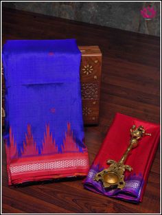 Luxurious Berhampuri pure silk saree in a blue with double pallu in red color. The body features small buttas with red phoda kumba border. Grand red double pallu has Ikkat woven patterns. Steal any special occasion with most vibrant Berhampuri pure silk. Colroful double pallu with Ikkat patterns, stunning color combo on body is just enough to make a statement. Part of the package is an unstitched blouse piece. Blouse - Unstitched. Fall and Pico - Done. Please note: Color may vary slightly from t Blue Handloom Traditional Wear For Ceremonies, Blue Handloom Paithani Silk Traditional Wear, Blue Handloom Traditional Silk Wear, Blue Handloom Saree For Traditional Ceremonies, Blue Tussar Silk Traditional Wear For Puja, Blue Dupatta With Weaving Work For Puja, Blue Traditional Wear With Weaving Work In Art Silk, Blue Cotton Silk Dupatta For Traditional Ceremonies, Blue Tussar Silk Traditional Wear With Weaving Work