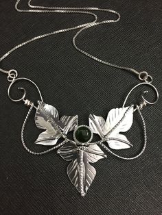 An Elvish and Woodland leaves inspired necklace I've designed, entirely in sterling silver, which will feature a glowing and rich 8mm cabochon gemstone within the center. This piece is approximately 3.5 inches across and I will attach a sterling silver box chain, to either end, for a total length of 18 inches when worn. If you prefer a different length, please contact me as I will adjust the chain to fit your preferences! I have offered various gemstone selection choices in the drop down menu fo Inspired Necklace, Silver Box, Felt Bag, Silver Gifts, Moon Pendant, Box Chain, Gemstone Necklace, Cuff Bracelets, Jewelry Box